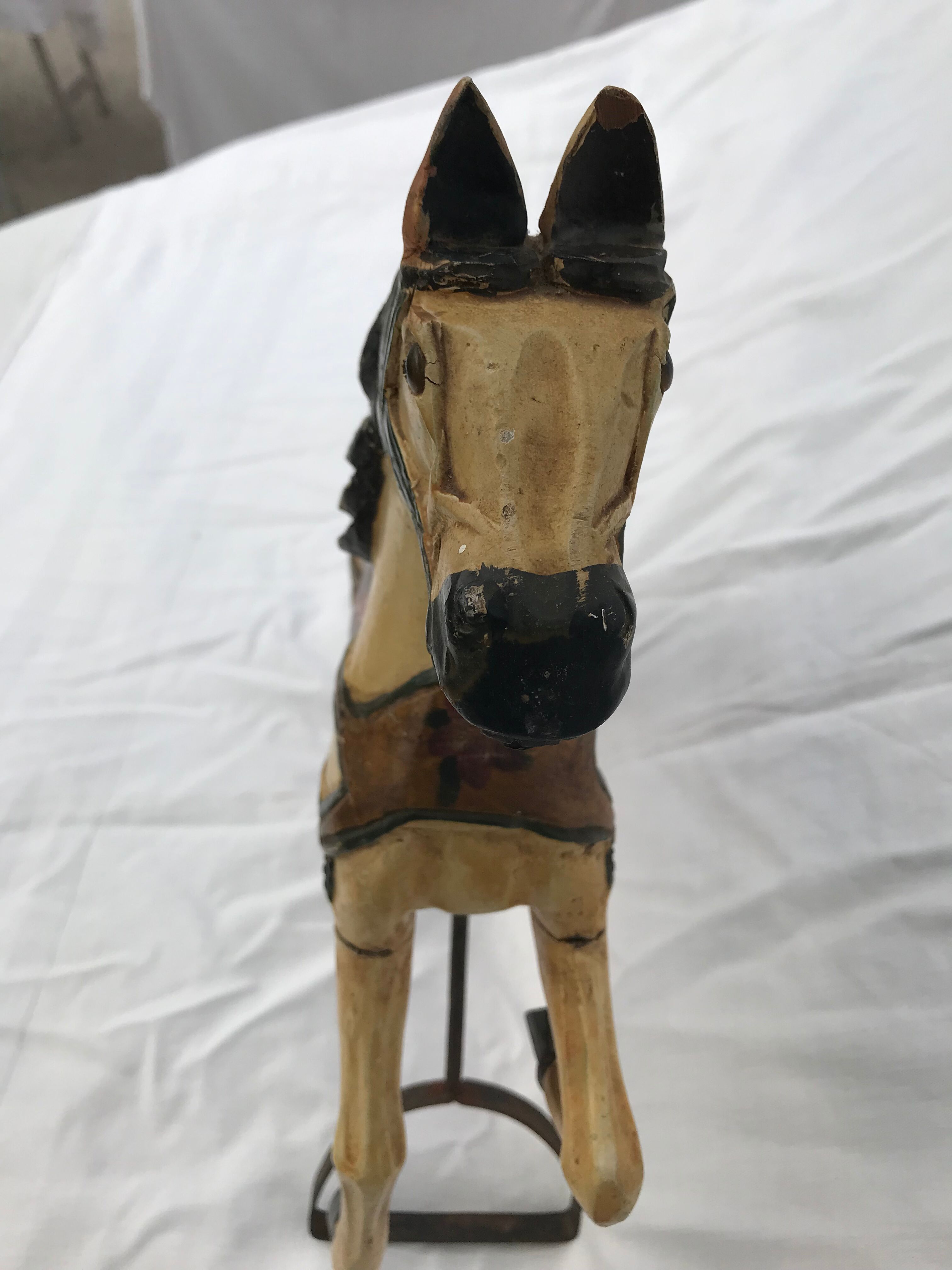 Wooden horse with period ironwork support