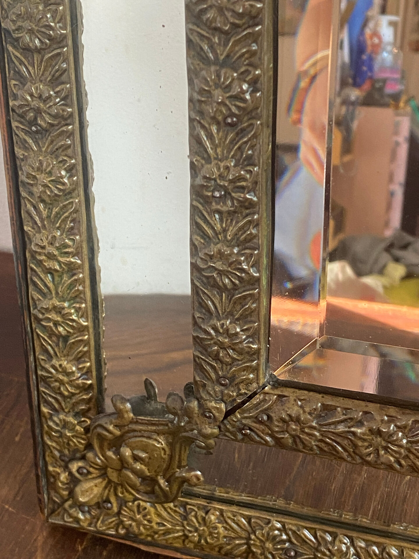 Mirror with brass repoussé frame