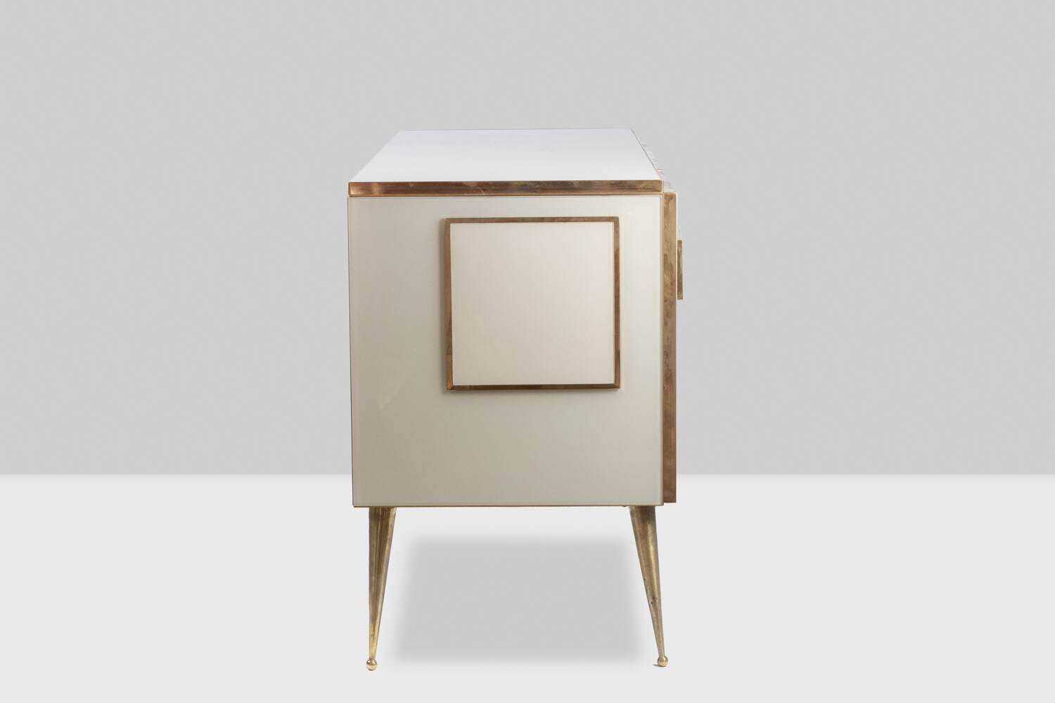 Geometric sideboard in glass and gilded brass. Contemporary Italian work.