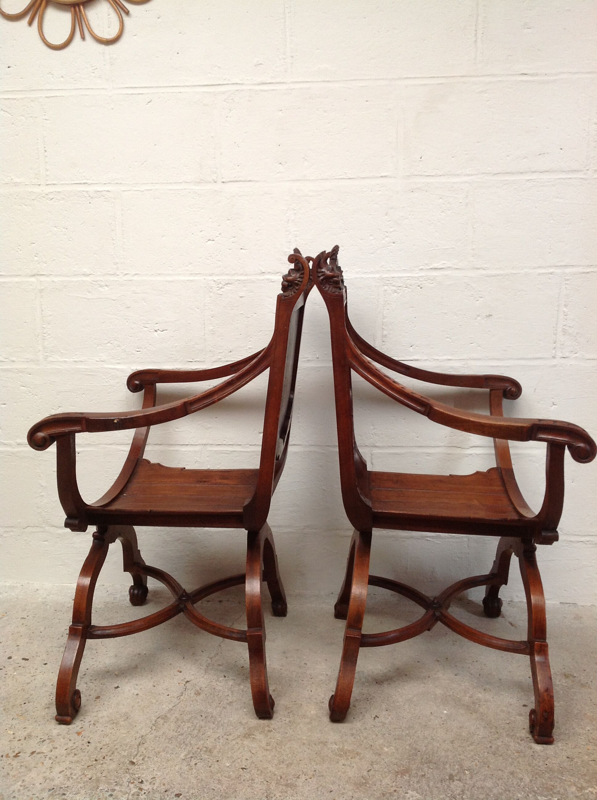Pair of antique armchairs curules called Dagobert in carved wood