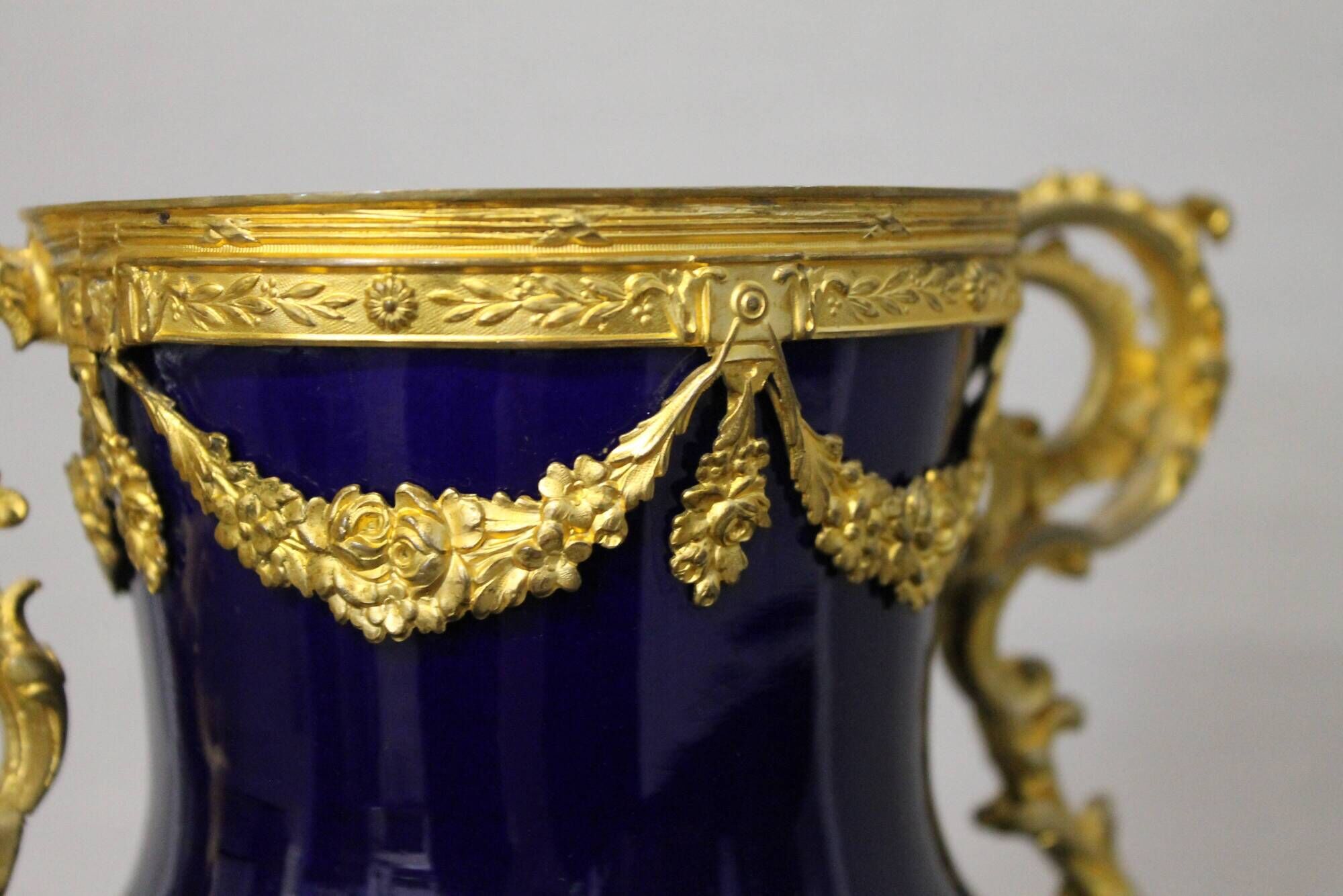 Vase signed Legastelois in blue ceramic of Sèvres and gilded bronze