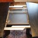 Baumann-type table with 4/8-person extensions.
