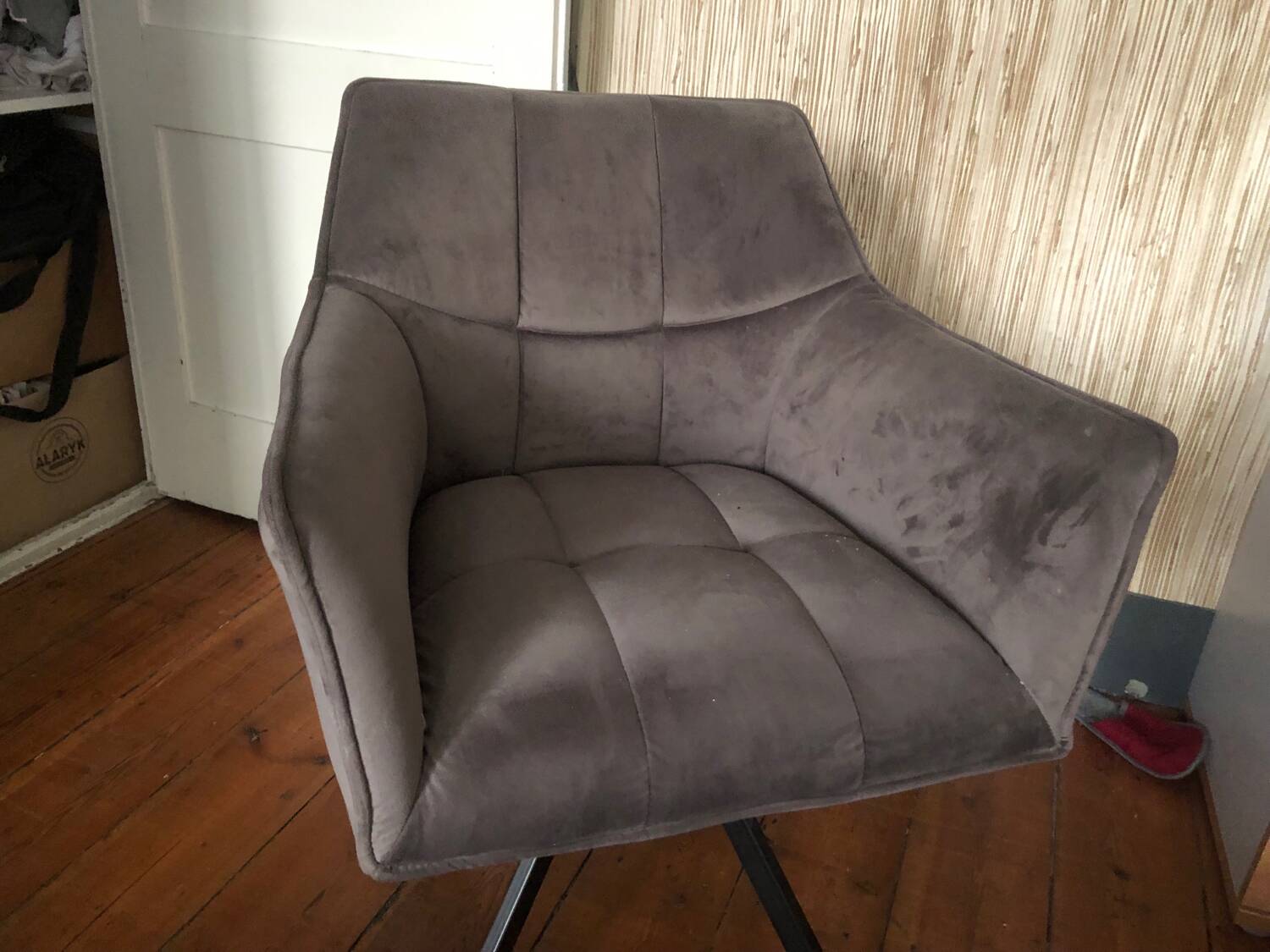 Grey fabric swivel chair in industrial style