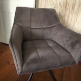 Grey fabric swivel chair in industrial style