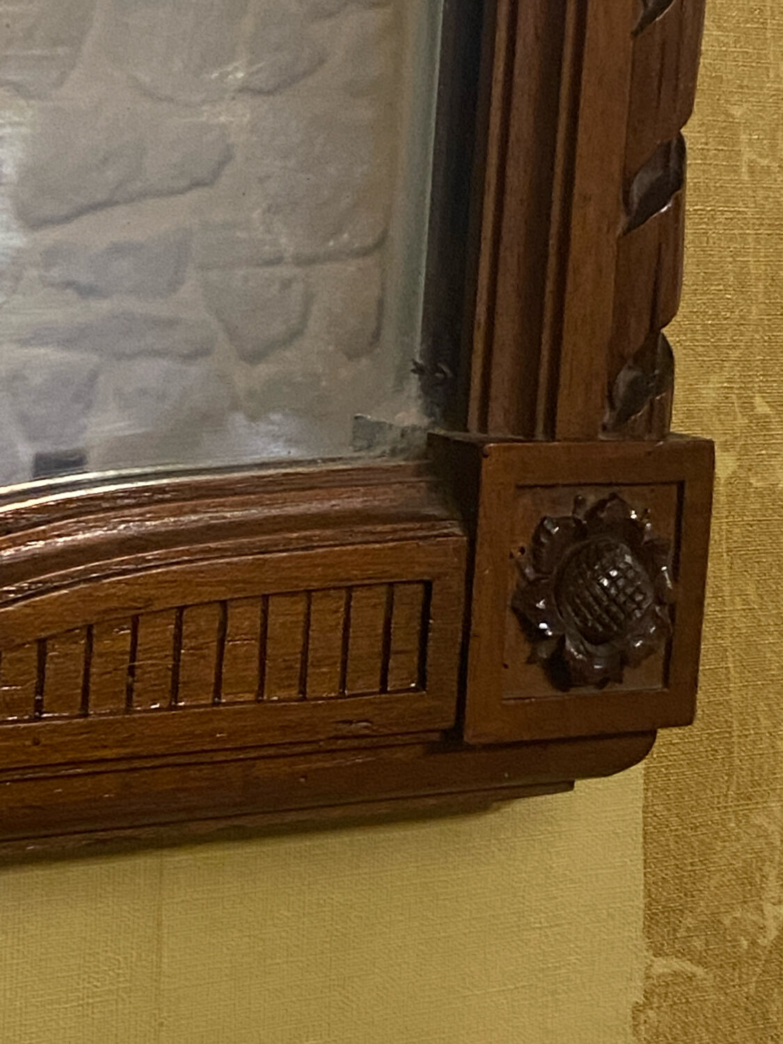 Carved wooden mirror in Louis XVI style