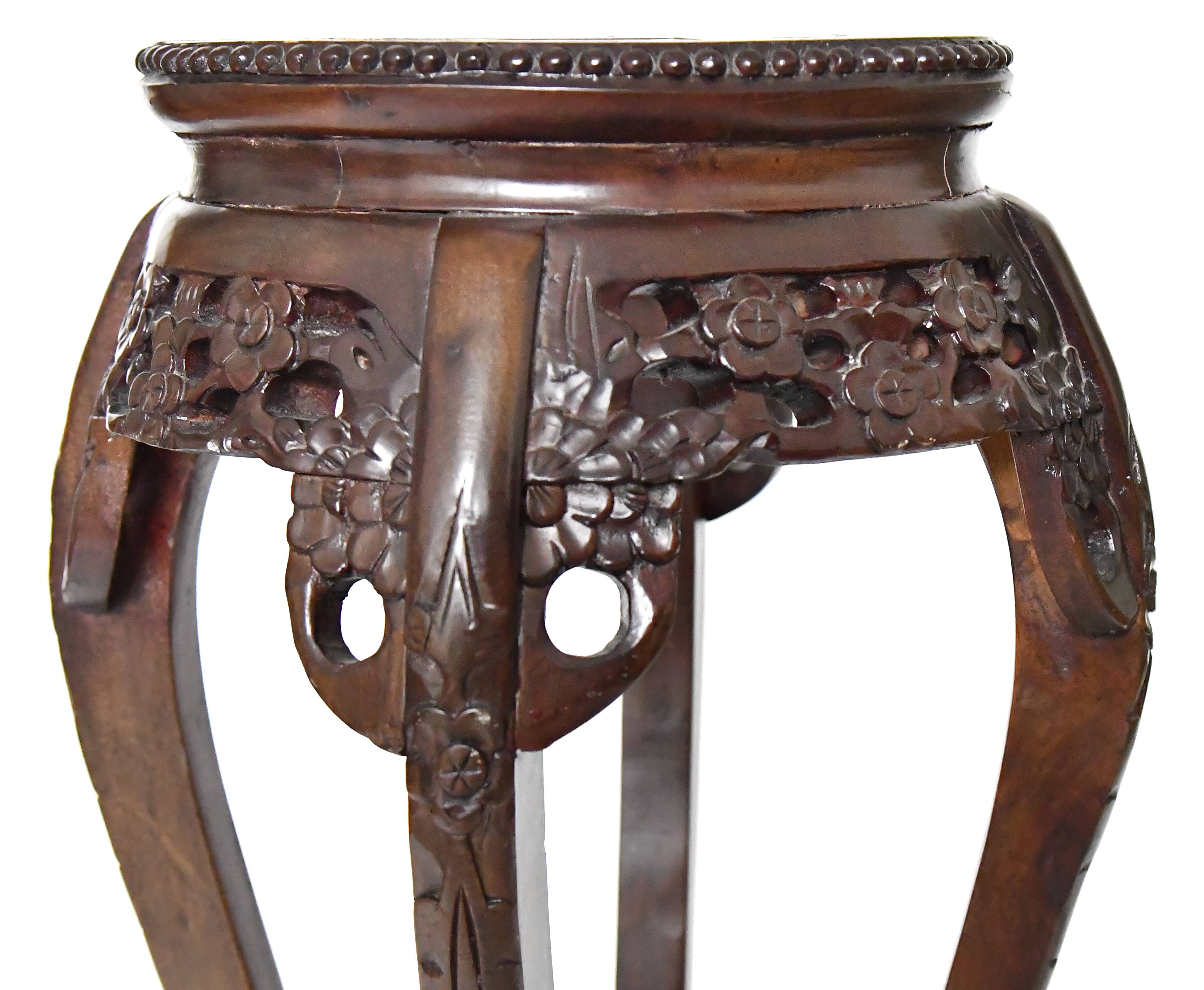 Chinese harness in richly carved wood and marble top