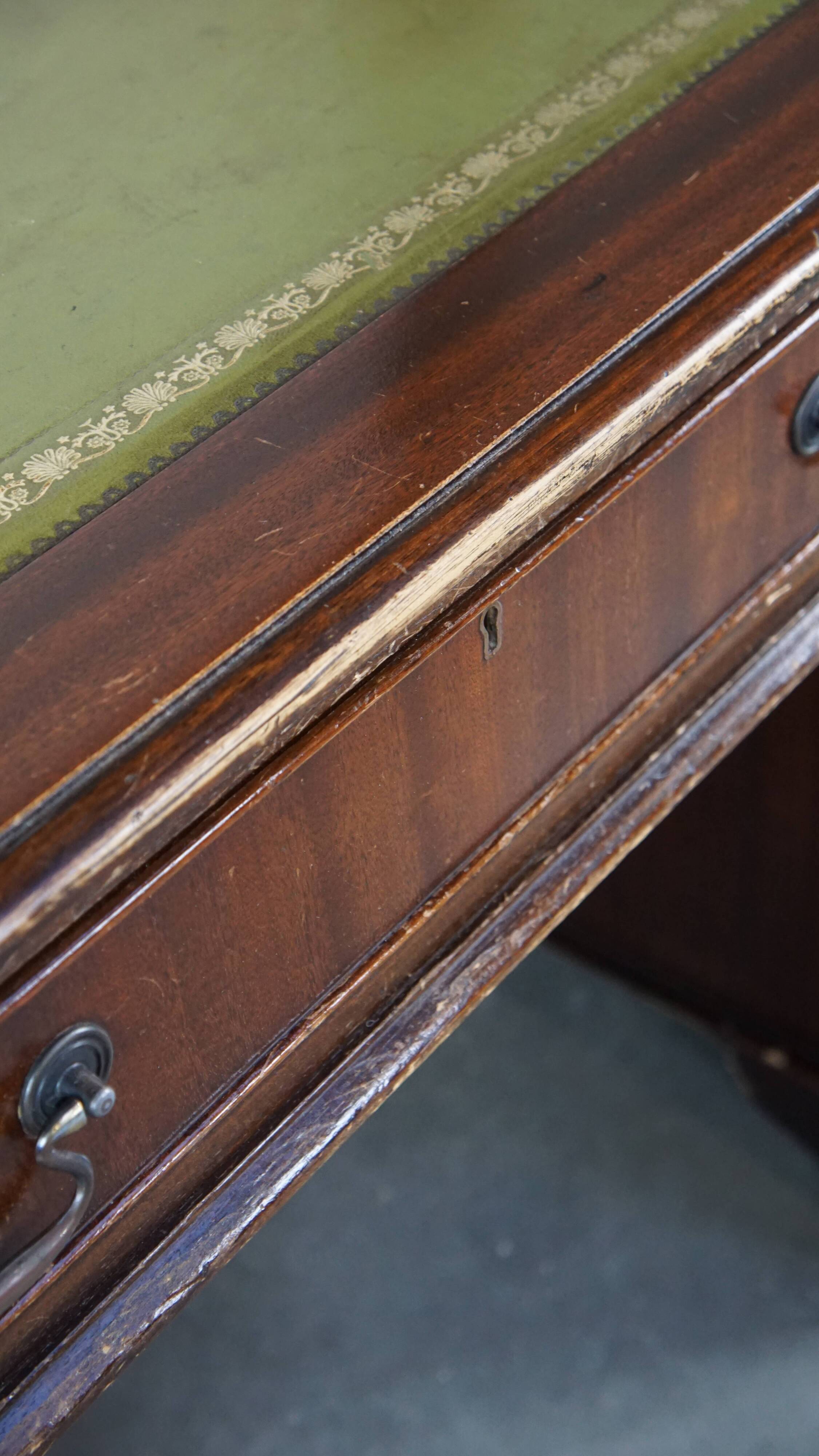 English style chesterfield desk with patina and a green leather top