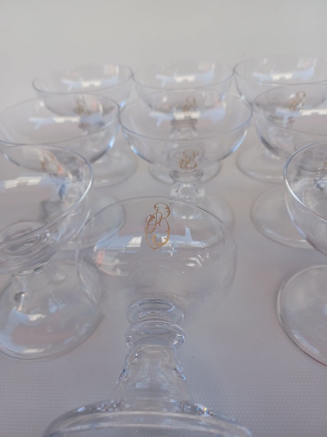 12 Val Saint Lambert crystal champagne glasses. Plain Bell Foot Service. Late 19th century.