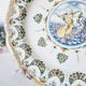 Antique plate in Moustiers faience, hand-painted, decorated with an s