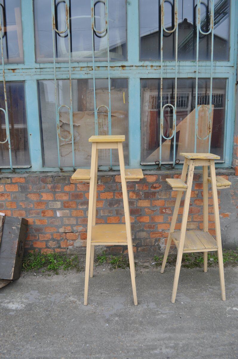 Vintage brown wooden plant stand from the 1940s — elegant footed support.