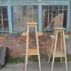 Vintage brown wooden plant stand from the 1940s — elegant footed support.