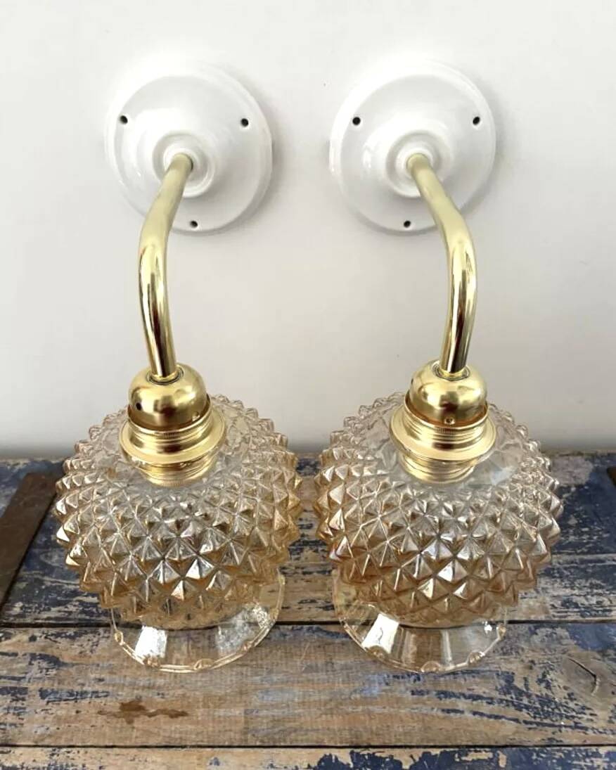 Pair of golden globe wall lights