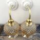 Pair of golden globe wall lights