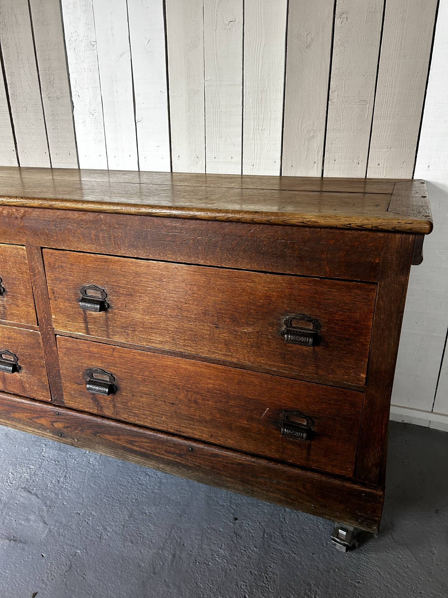Large antique haberdashery counter in oak