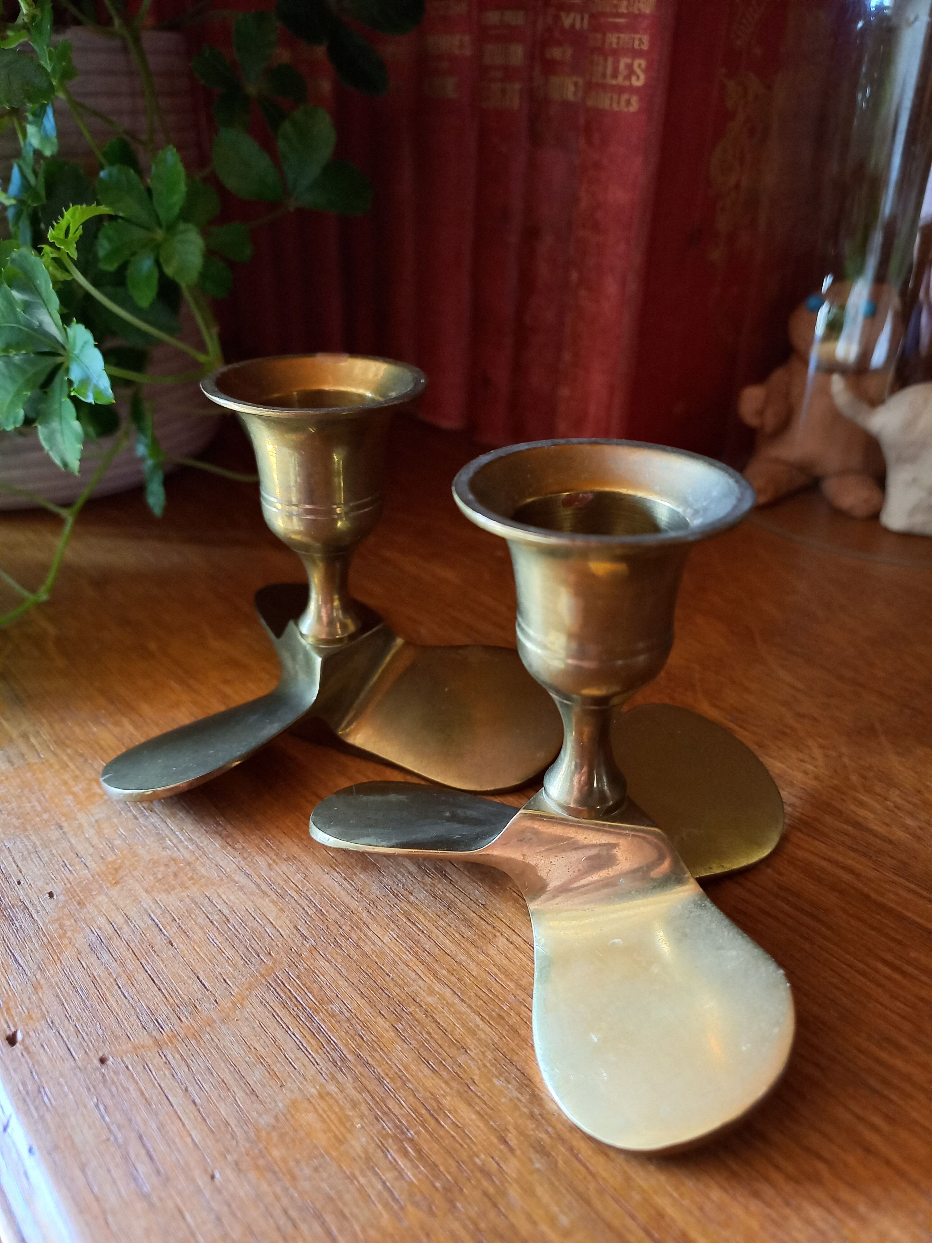 Pair of vintage propeller shape brass candle holders