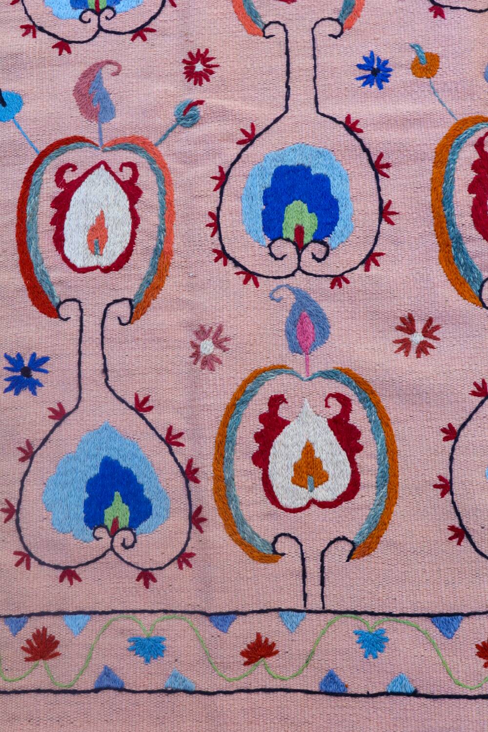 Salmon pink suzani kilim rug with embroidered patterns