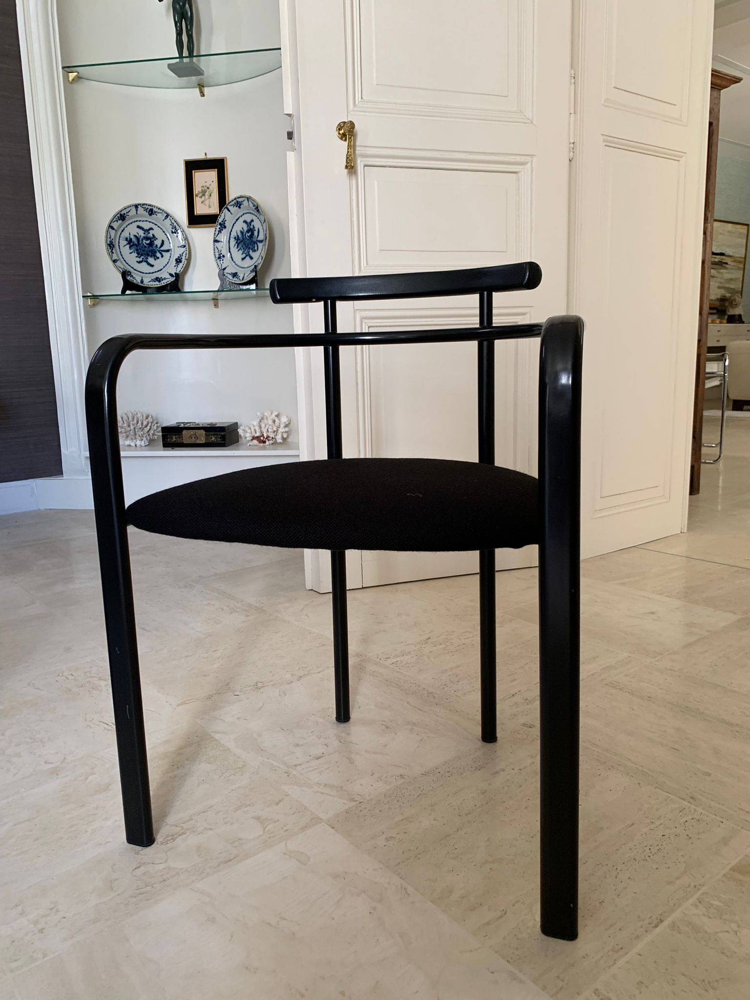 Black dining room table, wooden, rectangle with upholstered chairs.