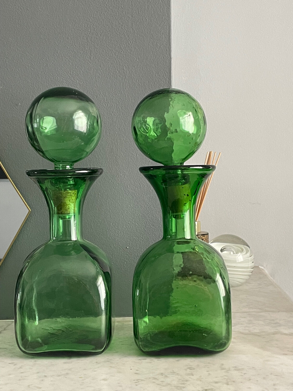 Two green glass decanters
