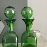 Two green glass decanters