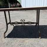 Vintage garden table with ceramic tile top and wrought iron base
