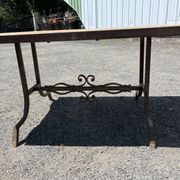 Vintage garden table with ceramic tile top and wrought iron base