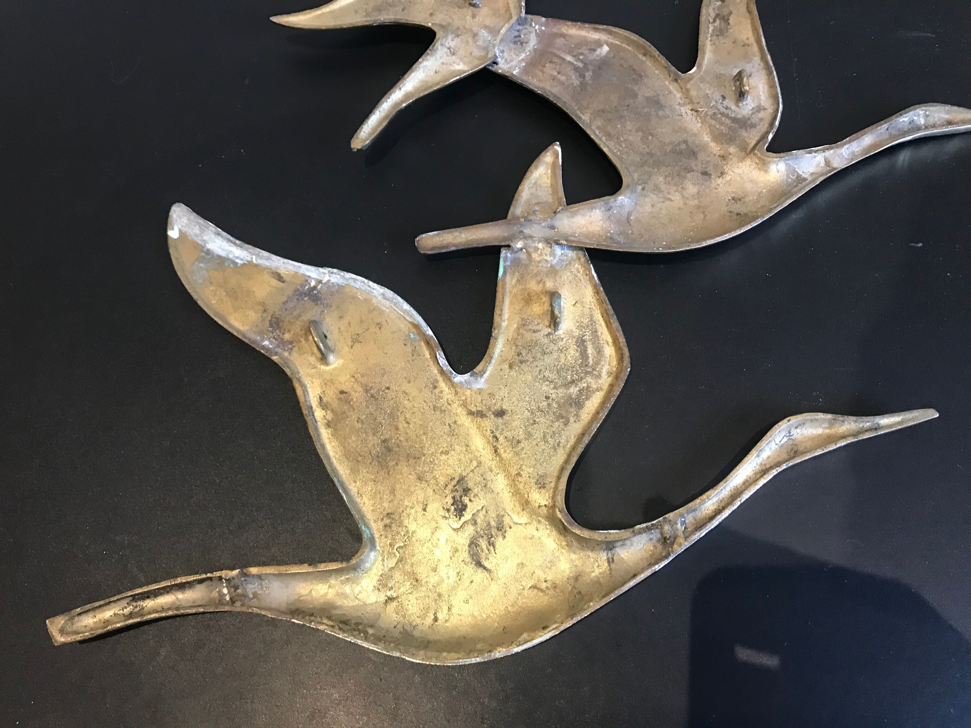 Birds in brass flight