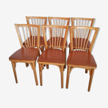 Suite de 6 chaises bistrot à barreaux Baumann