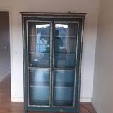 Glass cabinet in green patinated wood
