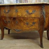 Curved Louis XV style commode with floral marquetry and marble top.