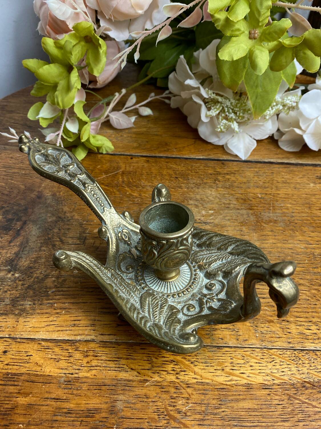 Hand candlestick, peacock shape, in bronze