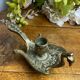 Hand candlestick, peacock shape, in bronze