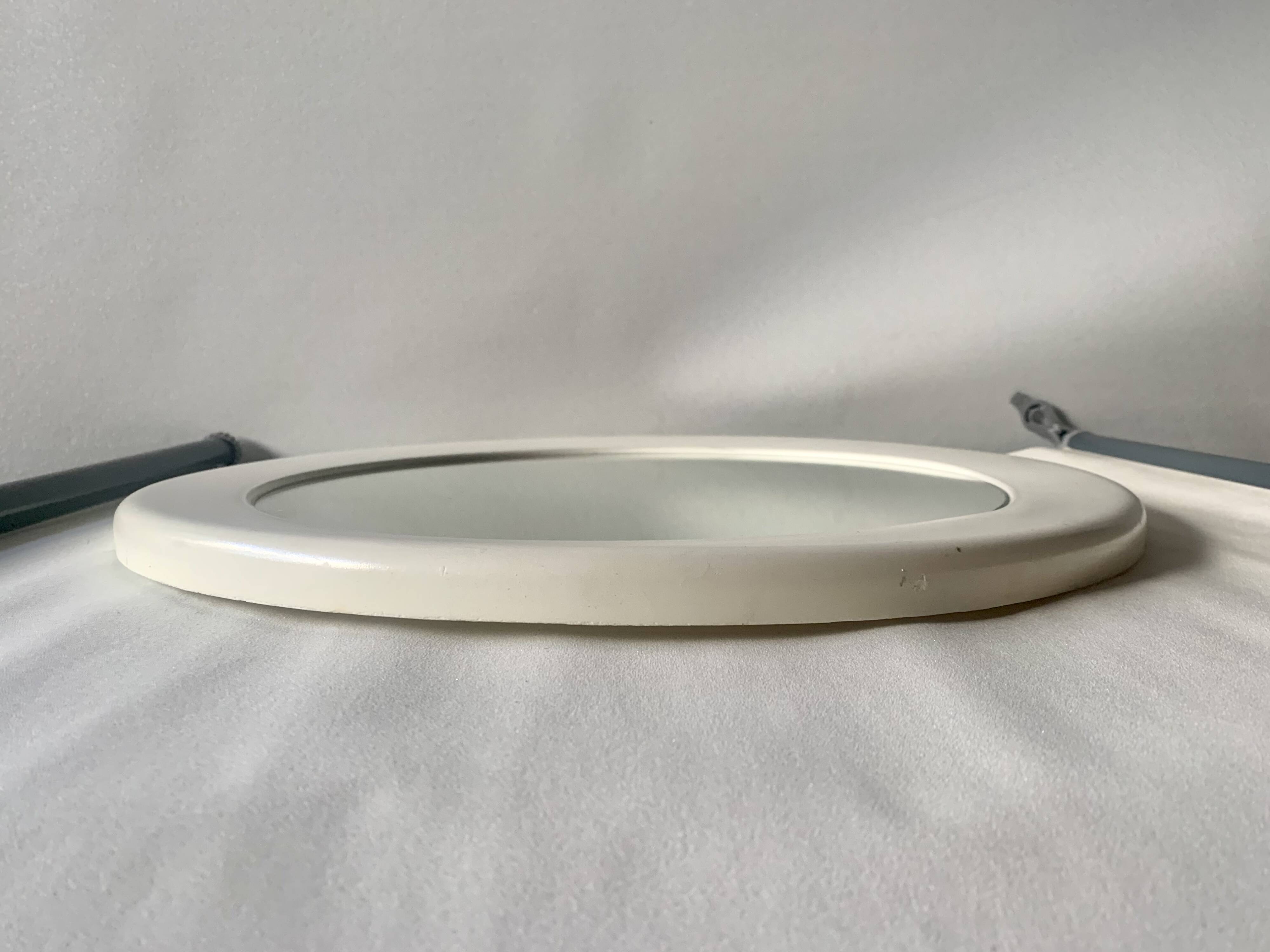 Vintage round white plastic mirror