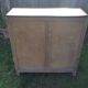 Parisian buffet painted in yellow with 2 doors and 2 drawers from an old Trailer.