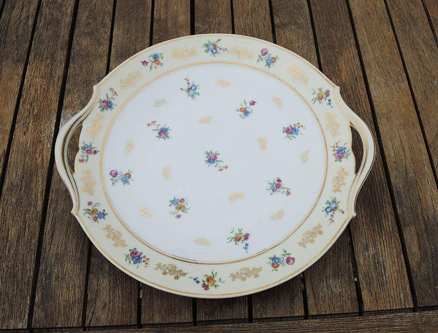 11 Limoges porcelain dessert plates, Raynaud & Co
