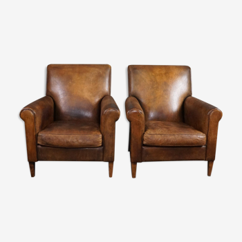 Suite of two armchairs in sheepskin