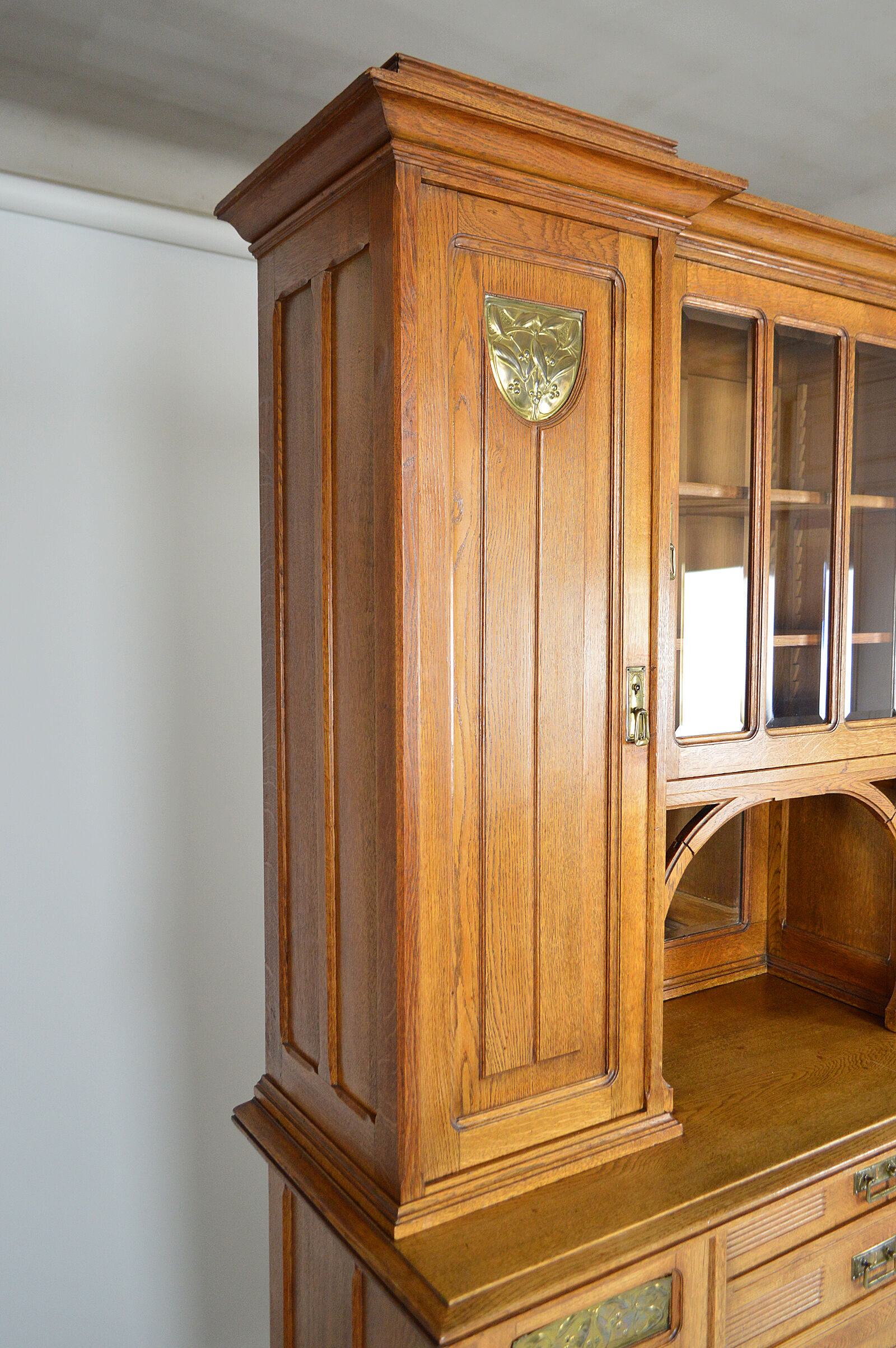 Art Nouveau oak buffet and dinanderie panels, circa 1910