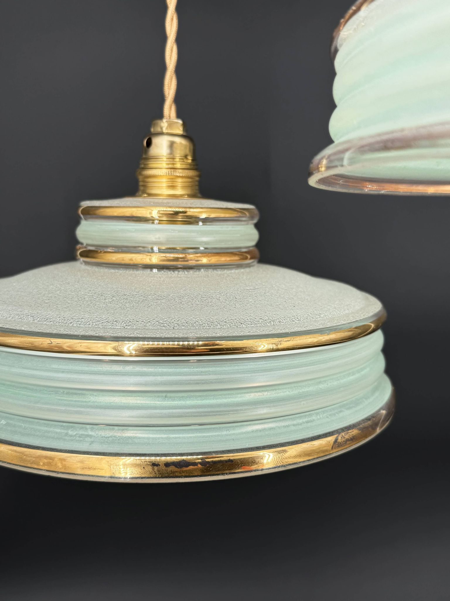 Set of 4 Art Deco pendant lights in frosted water green and gold.