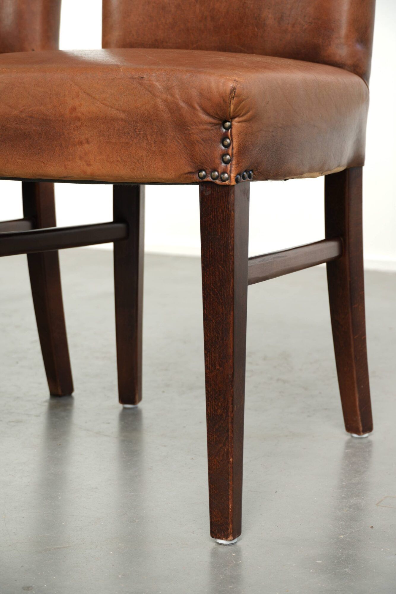 Set of 6 sheepskin dining chairs in a cognac colour with a lovely patina