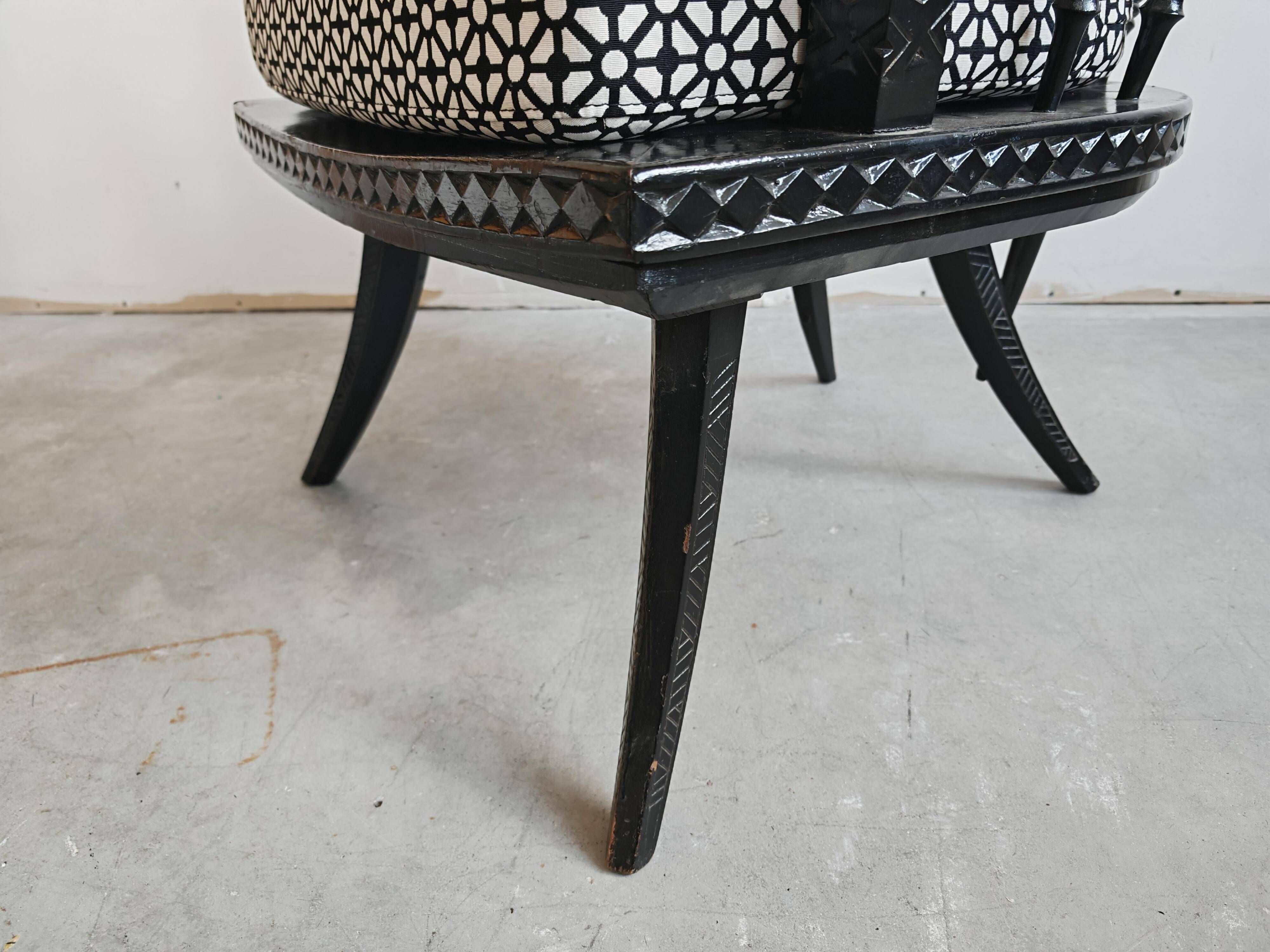 Pair of antique hand-carved armchairs in black lacquer from the 1920s.