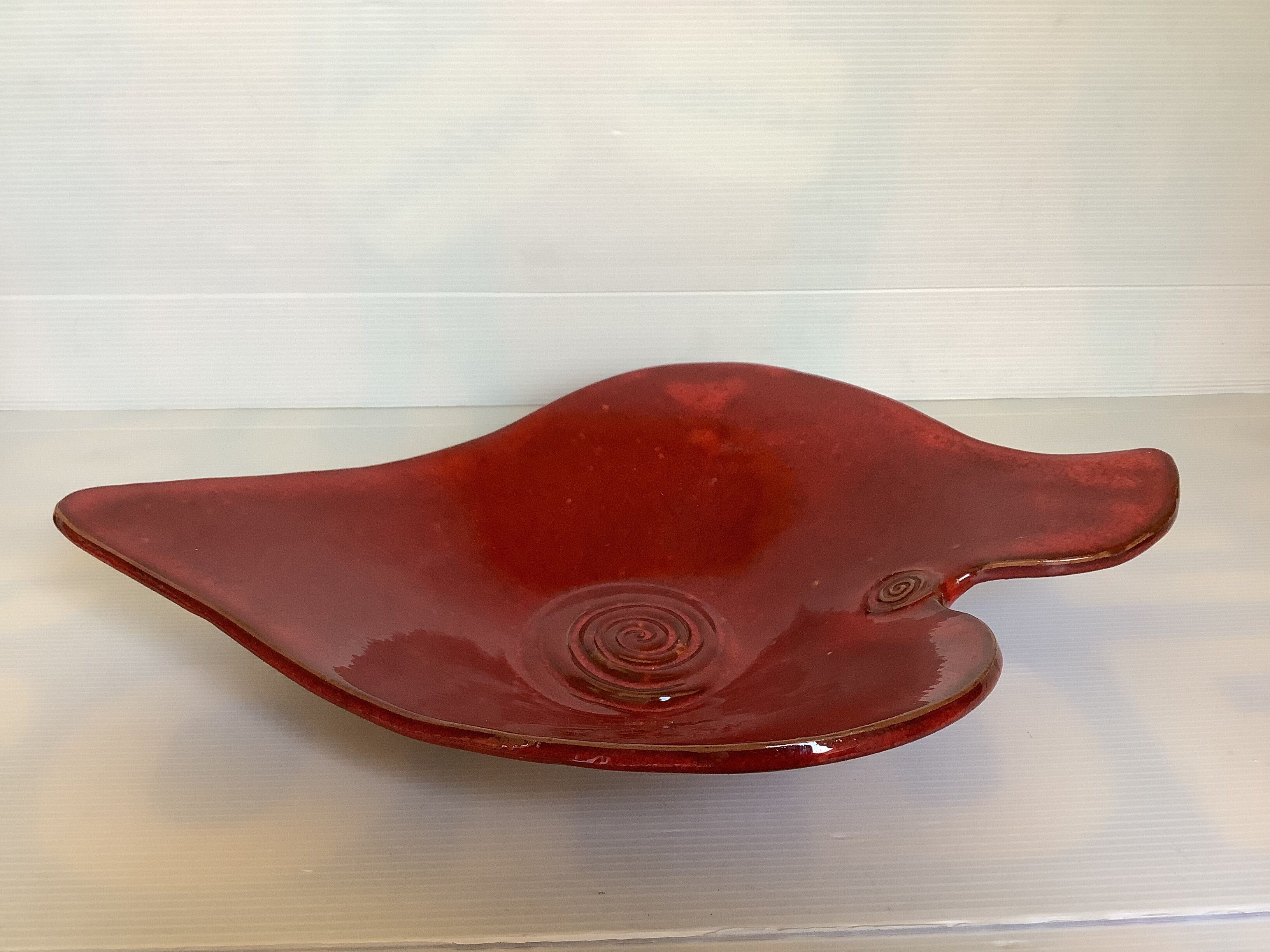 Red terracotta spiral pattern fruit bowl