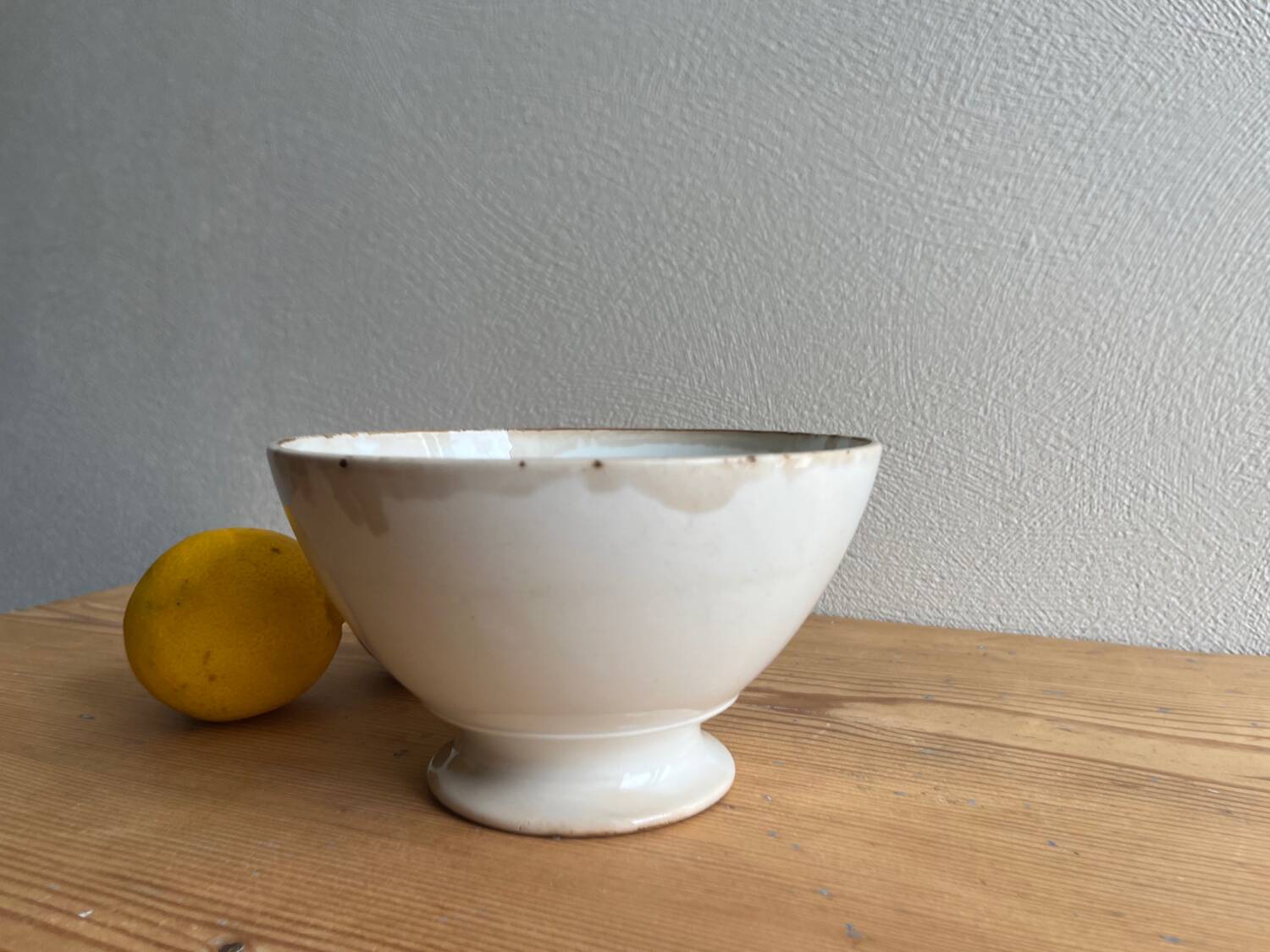 Old earthenware bowl on a pedestal, Badonviller, France.