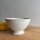 Old earthenware bowl on a pedestal, Badonviller, France.