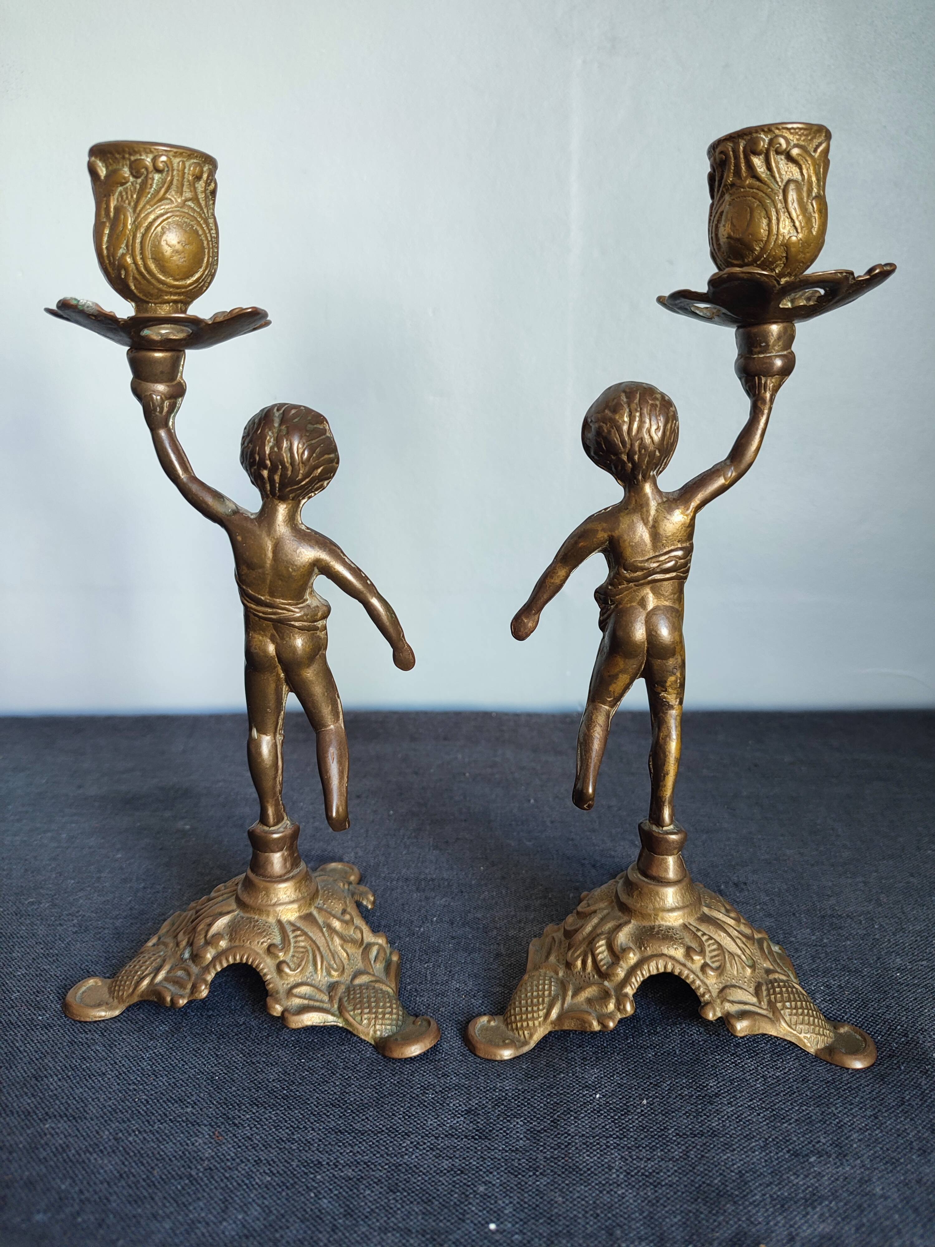 Set of two cherub cherub candlesticks