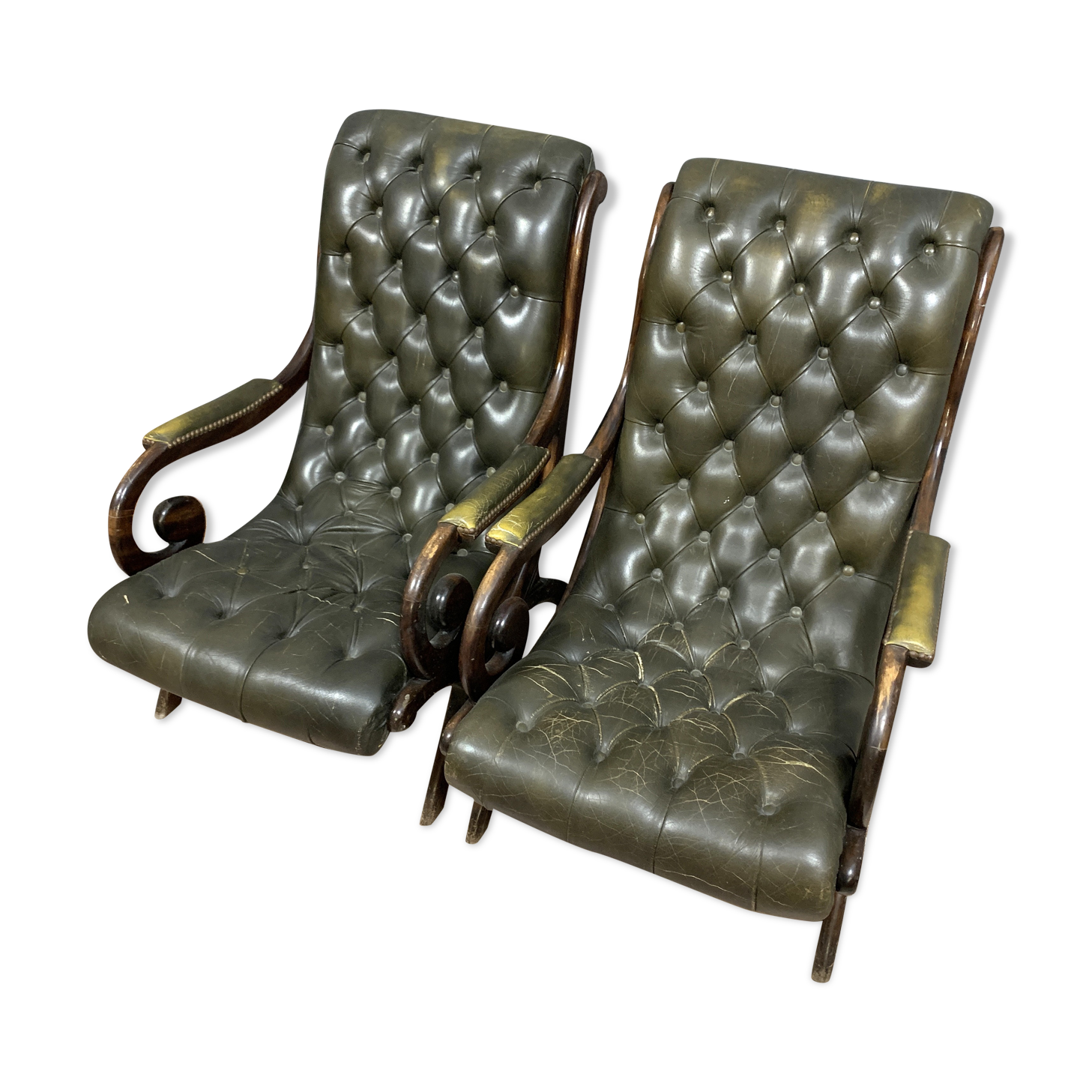 Pair of chesterfield armchairs in leather and stained wood circa 1940