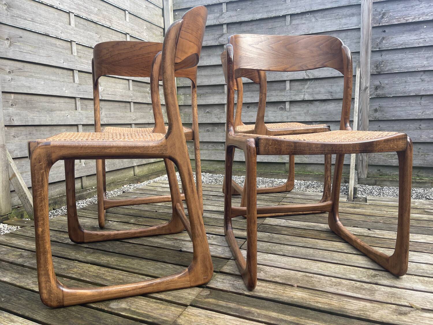 4 magnificent Baumann sled chairs, with caning.