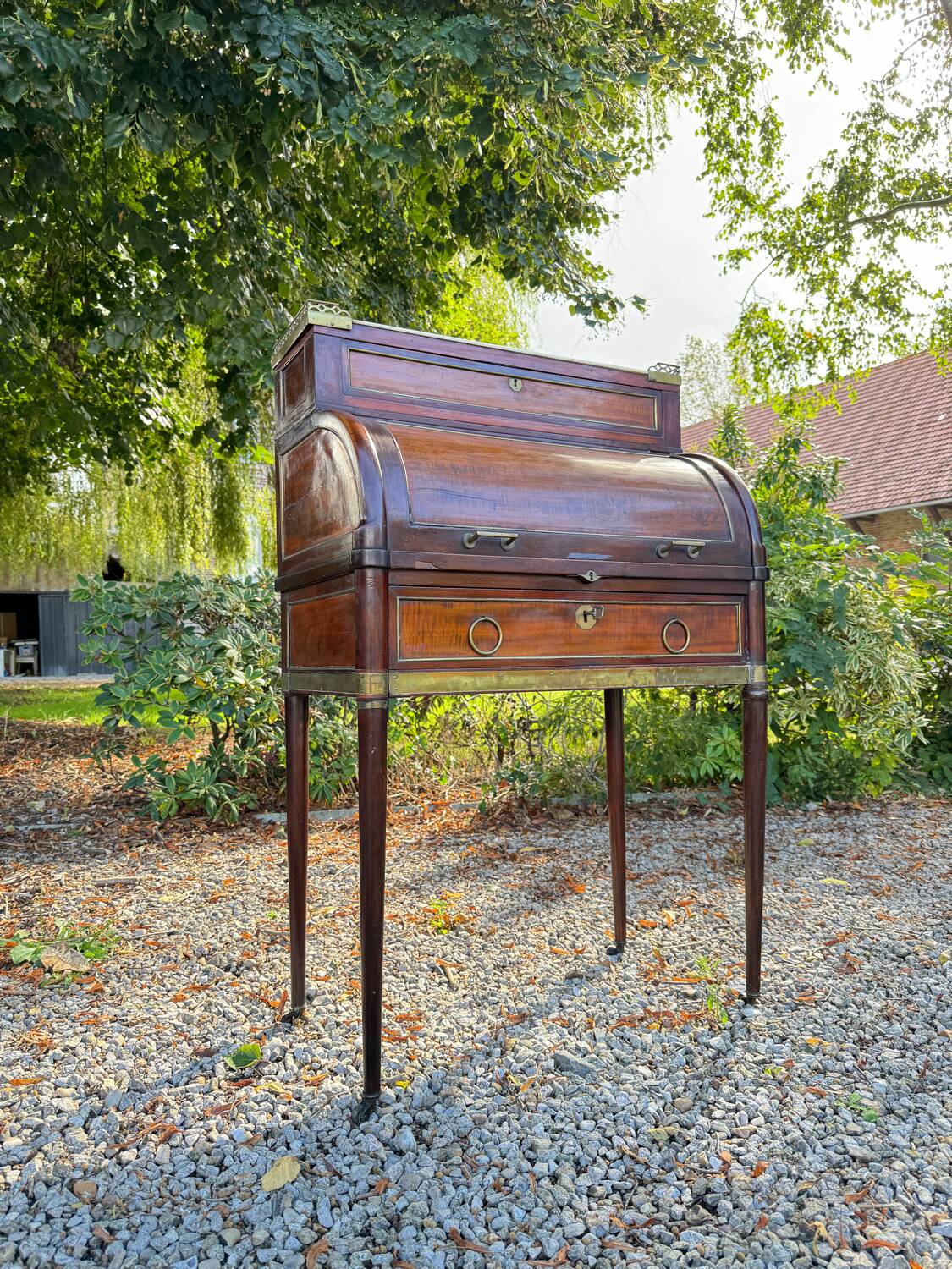 Elegant and rare Louis XVI period mahogany cylinder desk