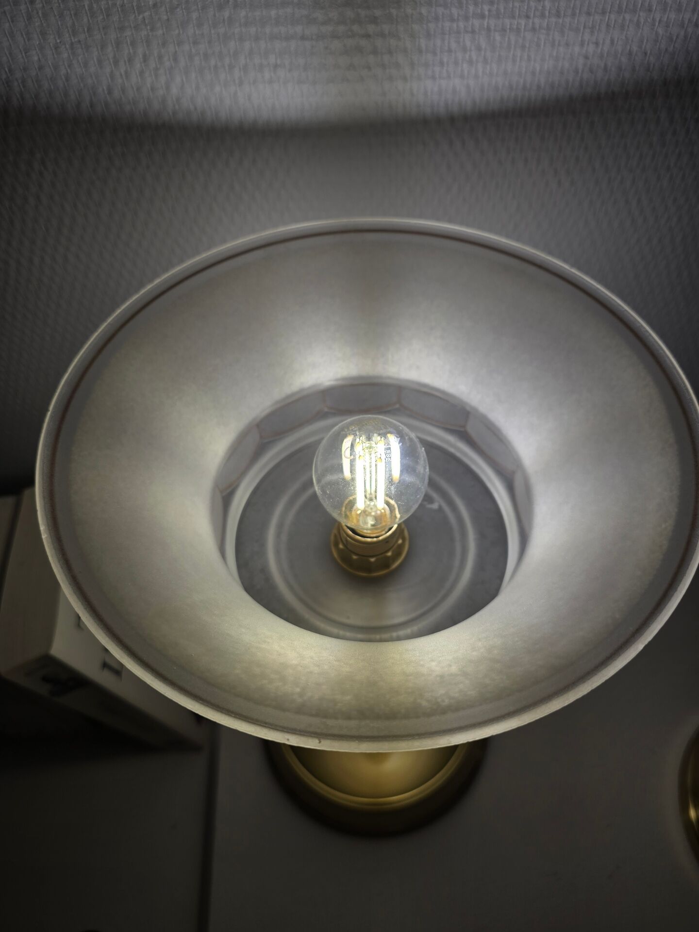 Art Deco table lamps with frosted glass shade and brass base.