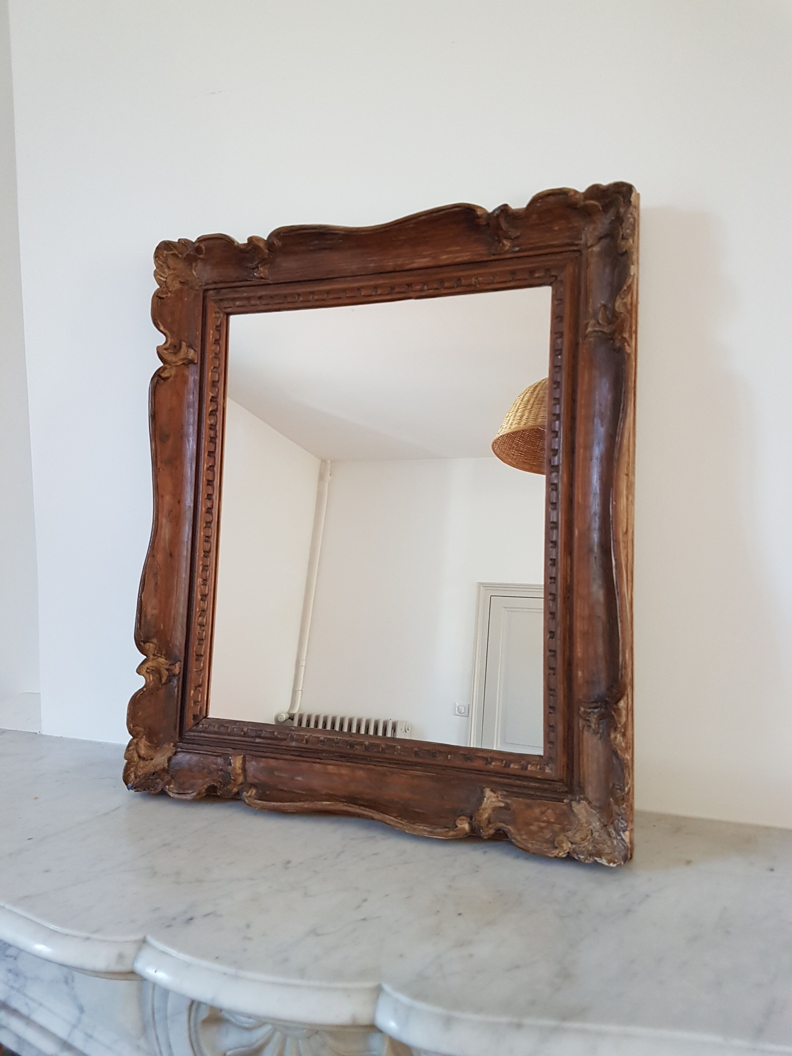 Carved wooden mirror