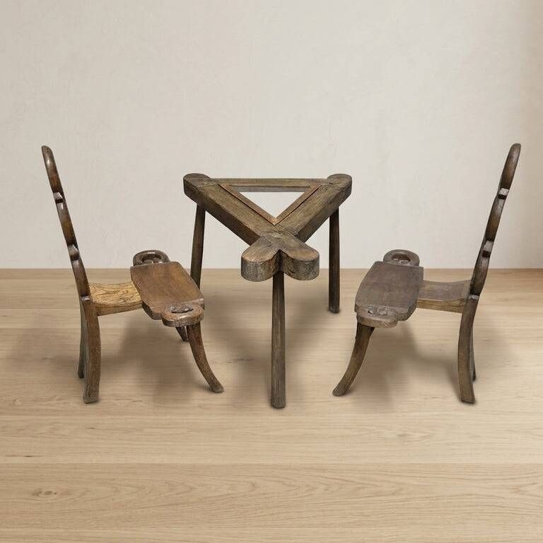 Vintage sculptural wooden table and two chairs, hand-carved loop backrests