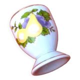 White porcelain egg cup decorated with pears / grapes.